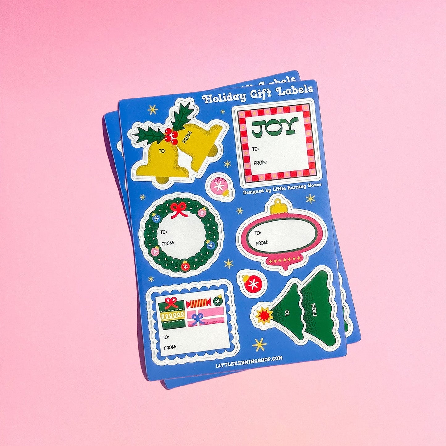 Set of holiday-themed gift labels on a pink background