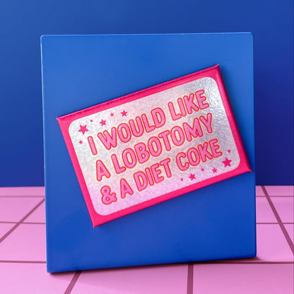 Glittery rectangle magnet with a pink border with text on a blue background