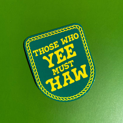 Sticker designed to look like a patch  with 'Those Who Yee Must Haw' text on a green background
