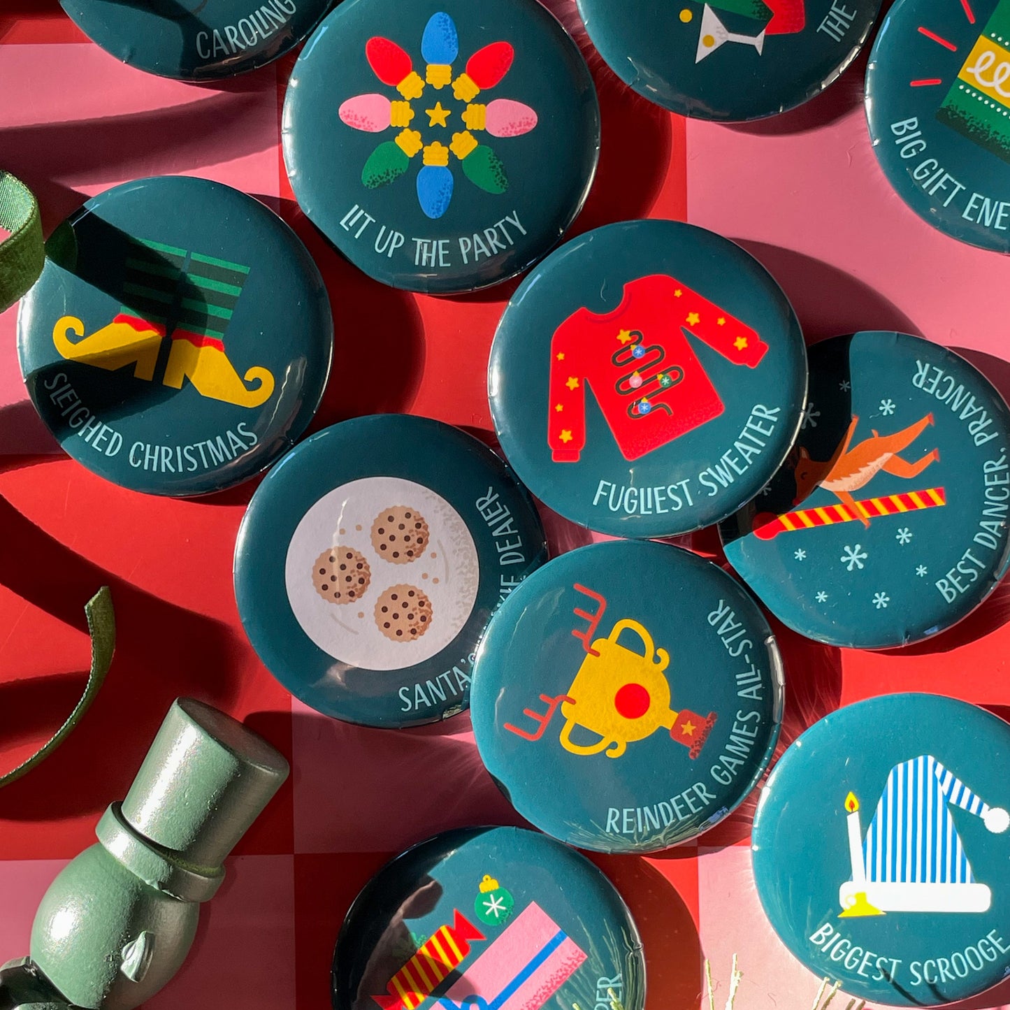 Collection of festive buttons on a red background