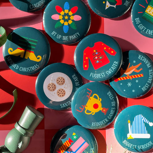 Collection of festive buttons on a red background