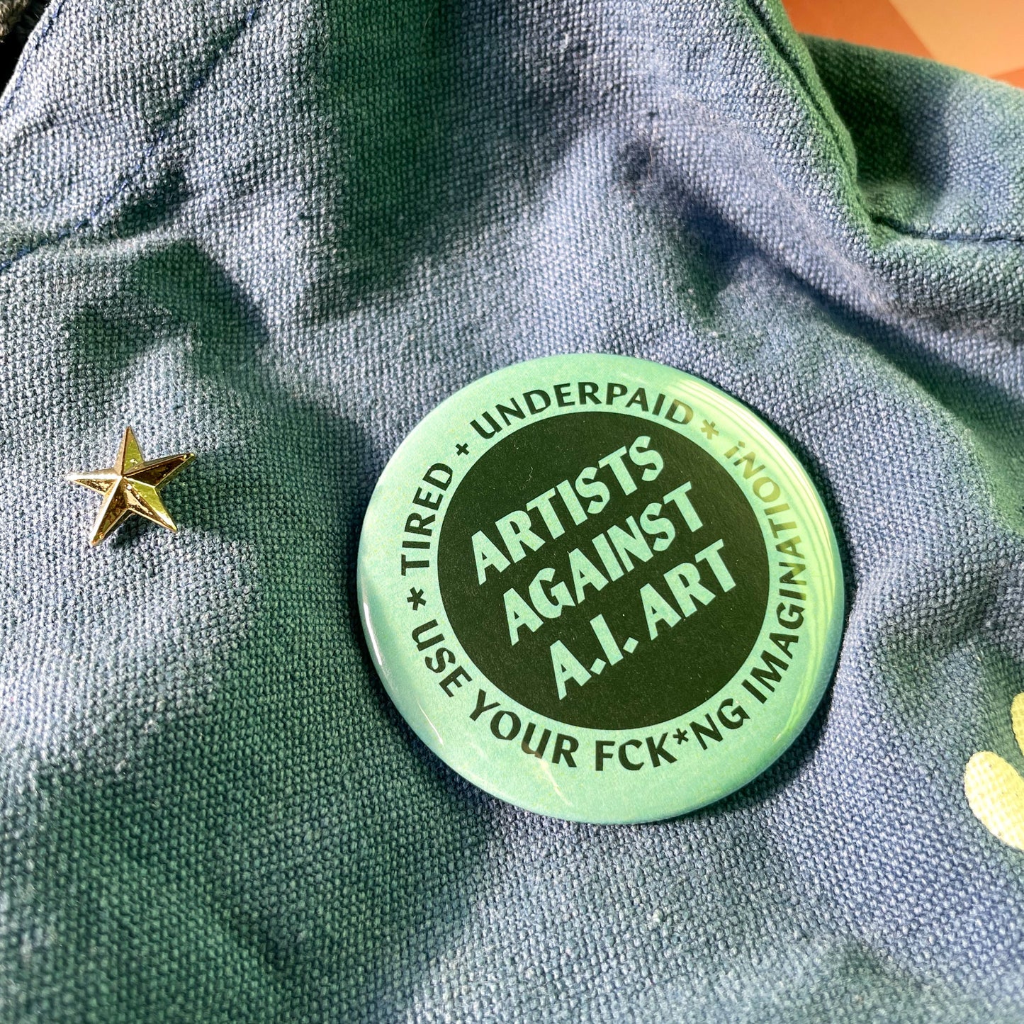 Green button with text on a green fabric background