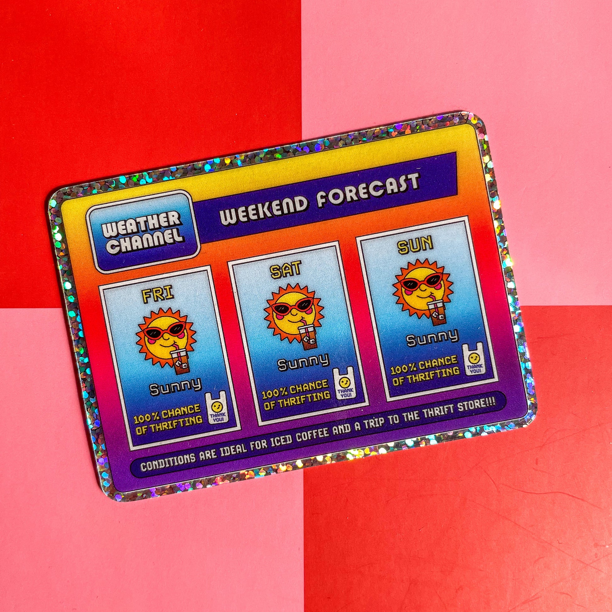 Rectangle sticker with a glitter border and a nostalgic and playful weather forecast illustration predicting sunny days ahead filled with iced coffee and good chances of thrifting on a red and pink checkered background